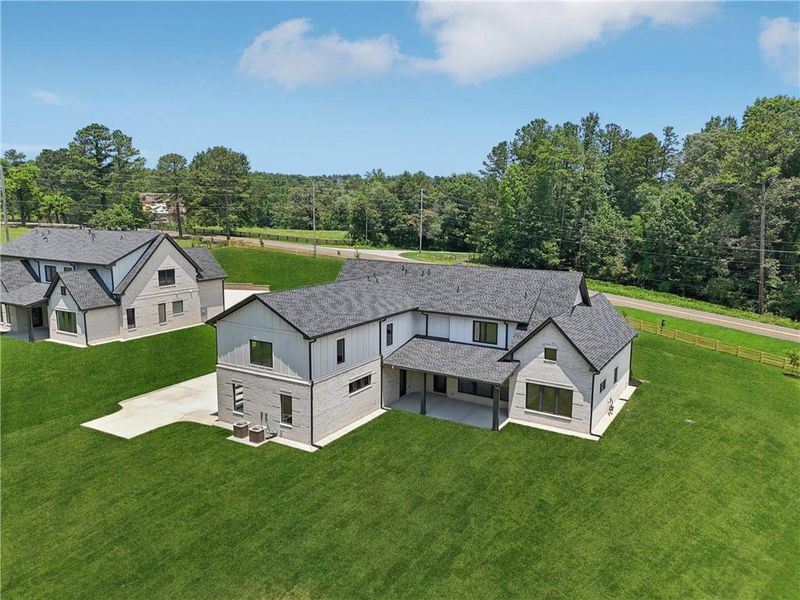 Front exterior of a new home in , Braselton, GA, highlighting curb appeal (Image 45).