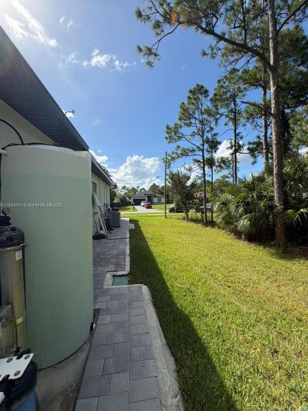Exterior details and patio area of a home in , Lehigh Acres (Image 11). Exterior details and patio area of a home in , Lehigh Acres (Image 11).