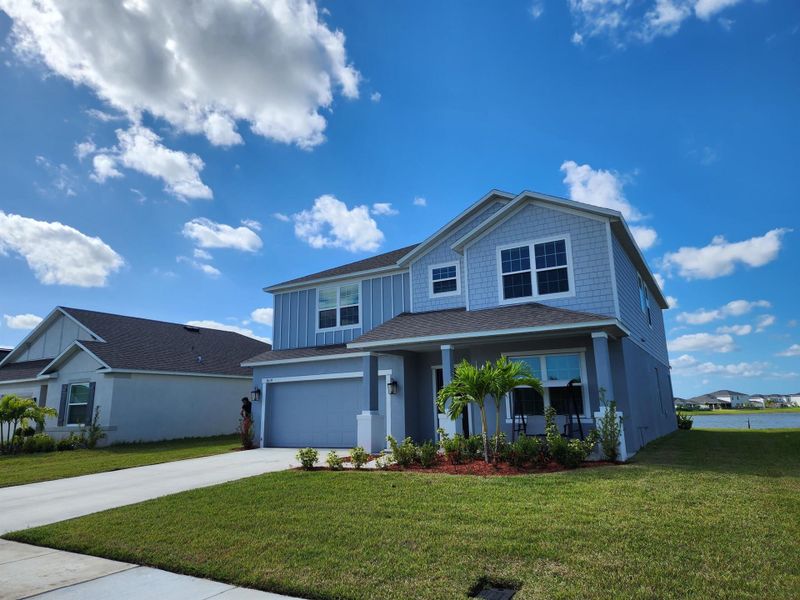 Front exterior of a new home in , Port St. Lucie, FL, highlighting curb appeal (Image 20). Front exterior of a new home in , Port St. Lucie, FL, highlighting curb appeal (Image 20).