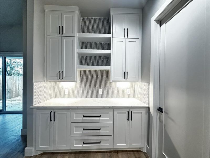 Kitchen with white cabinetry and open shelves Kitchen with white cabinetry and open shelves