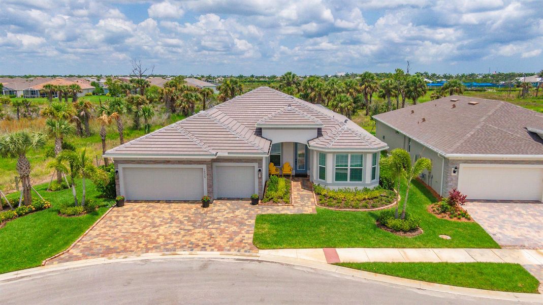 Front exterior of a new home in Del Webb Tradition, Port St. Lucie, FL, highlighting curb appeal (Image 1). Front exterior of a new home in Del Webb Tradition, Port St. Lucie, FL, highlighting curb appeal (Image 1).