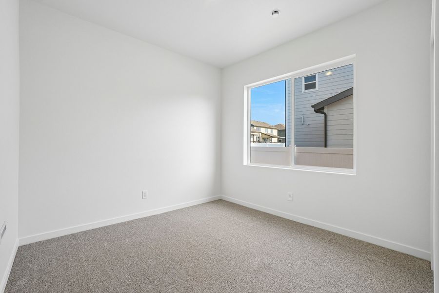 Spacious, unfurnished interior of a new home in Union Colony West, Greeley (Image 31).