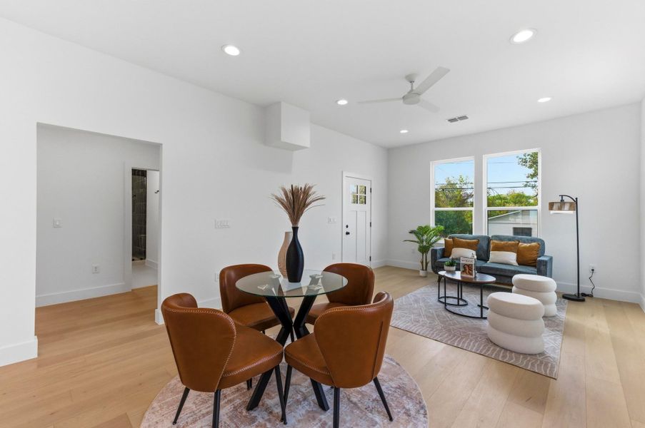 Dining area with light wood-style floors, recessed lighting, and ceiling fan