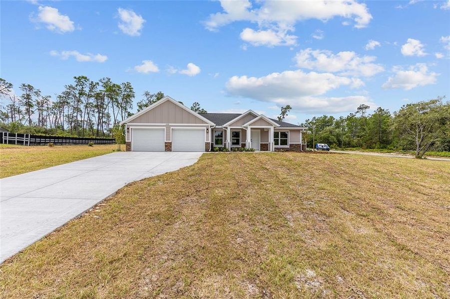 Front exterior of a new home in , Dunnellon, FL, highlighting curb appeal (Image 21). Front exterior of a new home in , Dunnellon, FL, highlighting curb appeal (Image 21).
