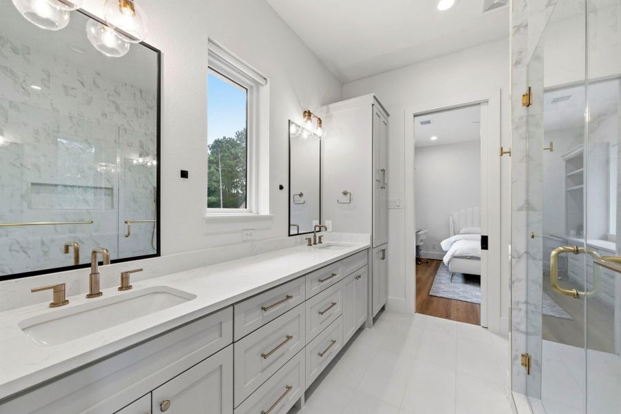 Impressive "Jack and Jill" bathroom with dual undermounted sinks and plenty of countertop space Impressive "Jack and Jill" bathroom with dual undermounted sinks and plenty of countertop space