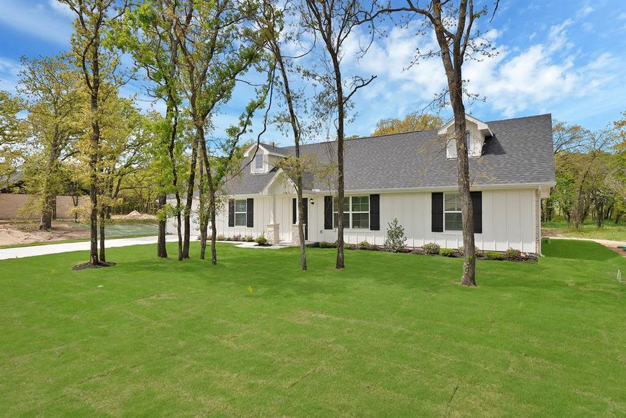Front exterior of a new home in , Poolville, TX, highlighting curb appeal (Image 18).