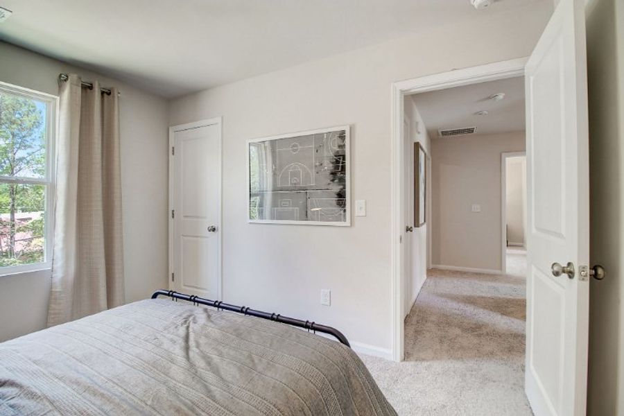 A bedroom with a large mirror. A bedroom with a large mirror.