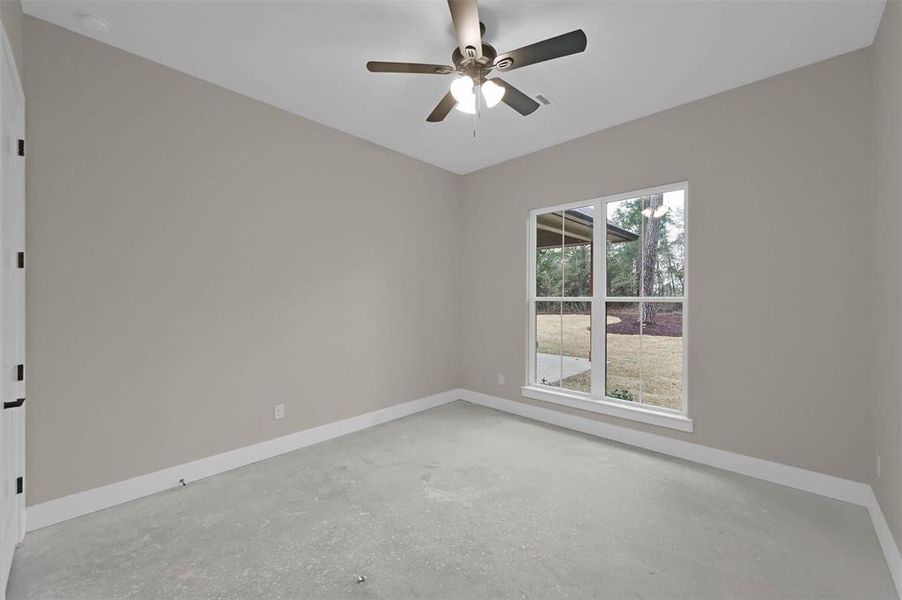 Bedroom 2 with view of the backyard