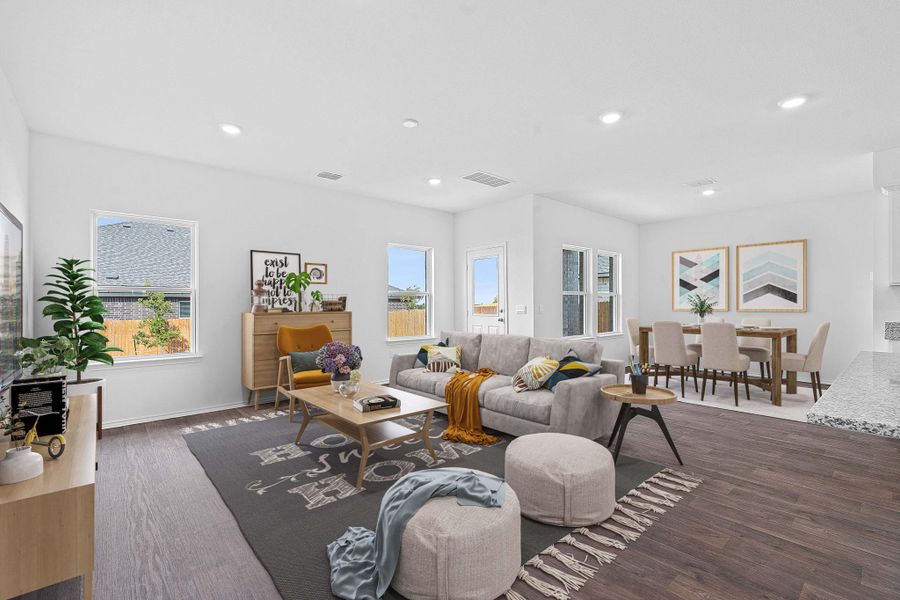 Living area featuring recessed lighting and dark wood-style flooring Living area featuring recessed lighting and dark wood-style flooring