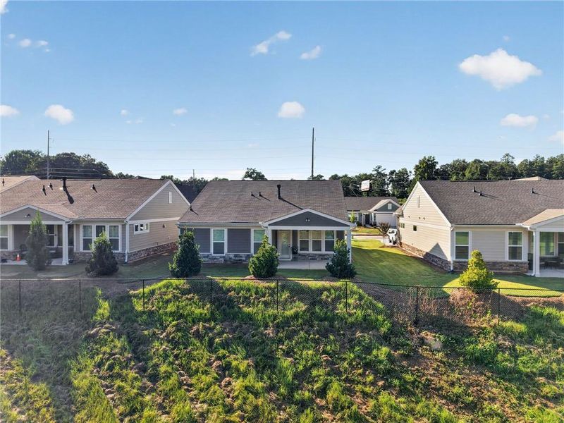 Front exterior of a new home in Laurel Farms, Dallas, GA, highlighting curb appeal (Image 20).