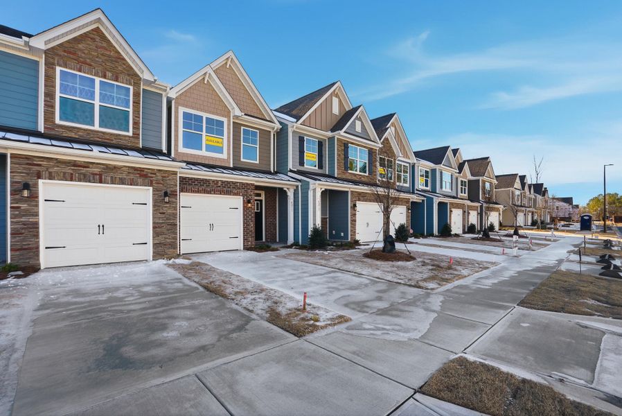 Front exterior of a new home in Harrisburg Village Townhomes, Harrisburg, NC, highlighting curb appeal (Image 2). Front exterior of a new home in Harrisburg Village Townhomes, Harrisburg, NC, highlighting curb appeal (Image 2).