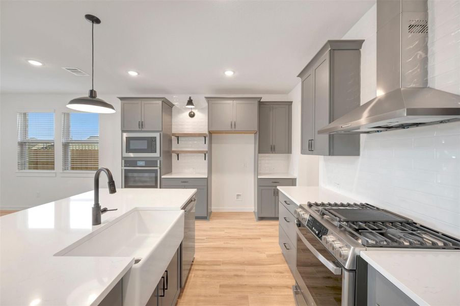 Stylish kitchen with grey cabinets