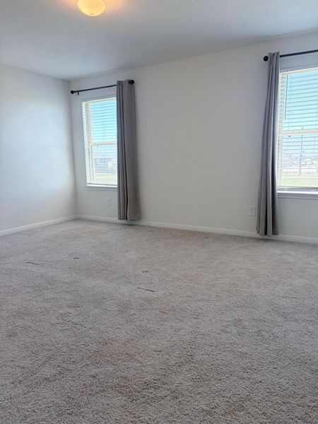Spacious, unfurnished interior of a new home in Sunterra, Katy (Image 24).