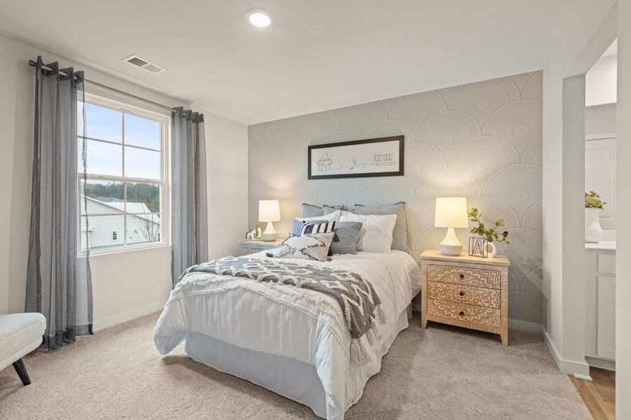 A bedroom with a large bed.