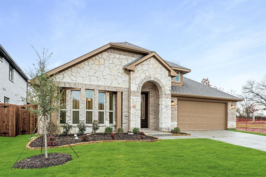 Front exterior of a new home in East Oak Creek 50-55, Commerce, TX, highlighting curb appeal (Image 19). Front exterior of a new home in East Oak Creek 50-55, Commerce, TX, highlighting curb appeal (Image 19).