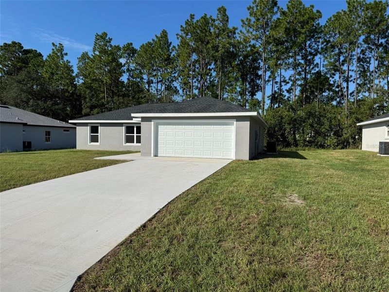 Front exterior of a new home in , Ocala, FL, highlighting curb appeal (Image 22).
