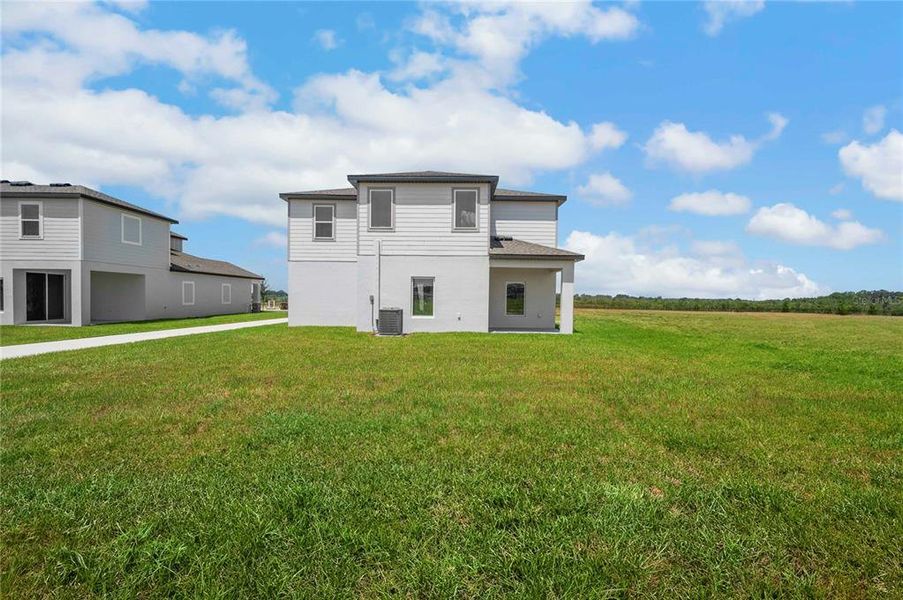 Front exterior of a new home in Gum Lake Preserve, Lake Alfred, FL, highlighting curb appeal (Image 2).