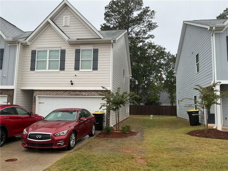 Front exterior of a new home in , Hampton, GA, highlighting curb appeal (Image 1). Front exterior of a new home in , Hampton, GA, highlighting curb appeal (Image 1).