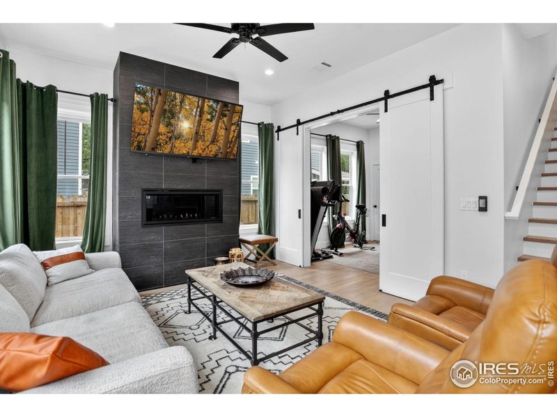 Snuggle up in front of the fire in the cozy family room. Snuggle up in front of the fire in the cozy family room.