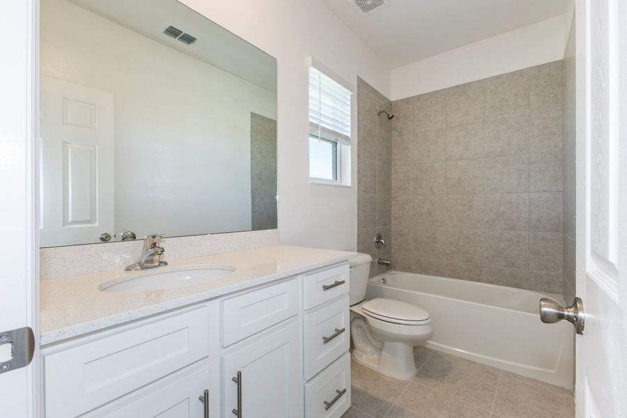 Representative furnished interior of a home built from the Madison by Park Square Residential in Townwalk at Babcock Ranch, Punta Gorda (Image 9).