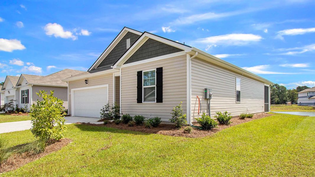 Front exterior of a new home in The Bluffs at Mill Creek, Florence, SC, highlighting curb appeal (Image 18).