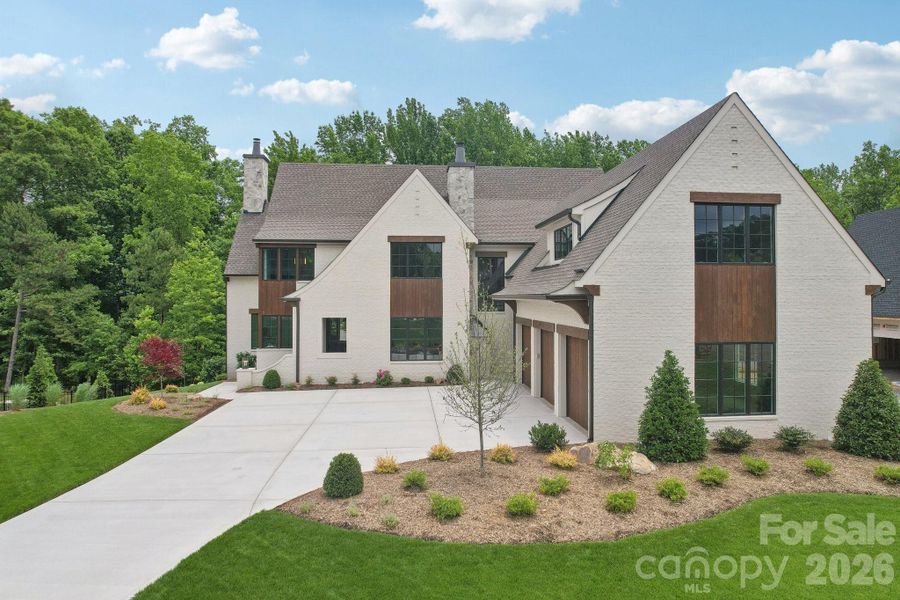 Front exterior of a new home in Cardinal Crest, Weddington, NC, highlighting curb appeal (Image 2). Front exterior of a new home in Cardinal Crest, Weddington, NC, highlighting curb appeal (Image 2).