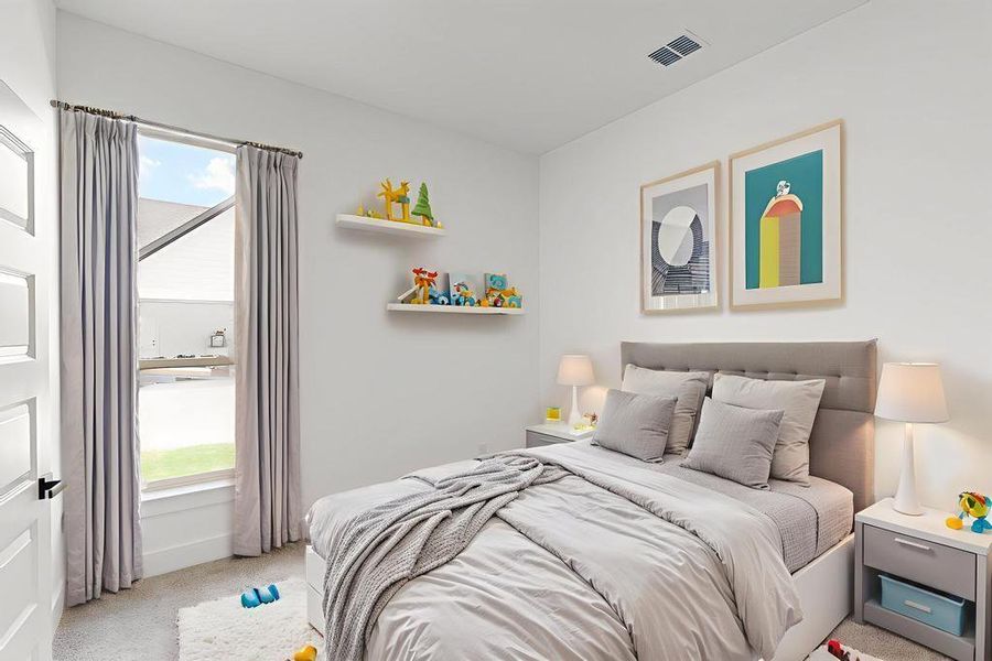 Bedroom with light carpet