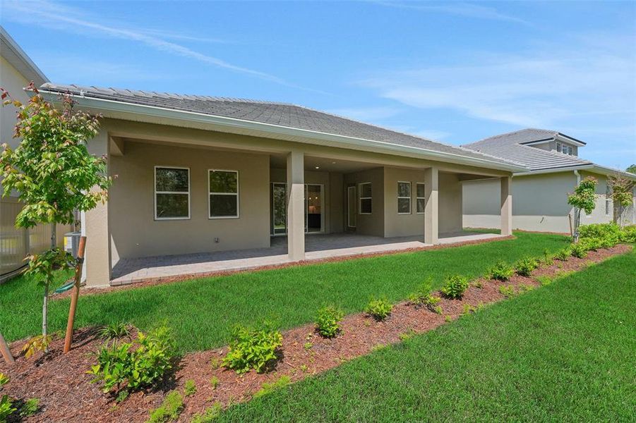 Exterior details and patio area of a home in Palms at Windermere, Windermere (Image 24).