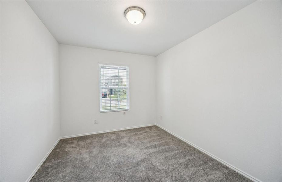 Spacious secondary bedroom with large windows