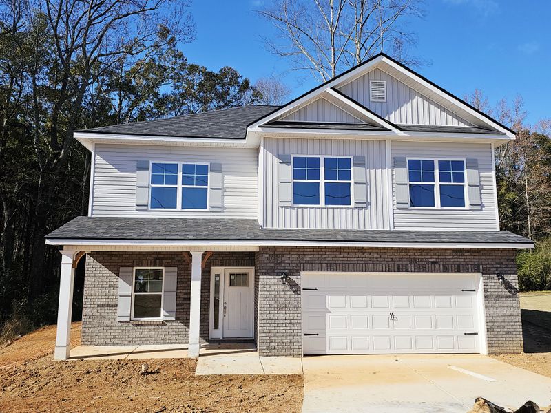 Front exterior of a new home in Scarlett Place, Bowdon, GA, highlighting curb appeal (Image 1). Front exterior of a new home in Scarlett Place, Bowdon, GA, highlighting curb appeal (Image 1).