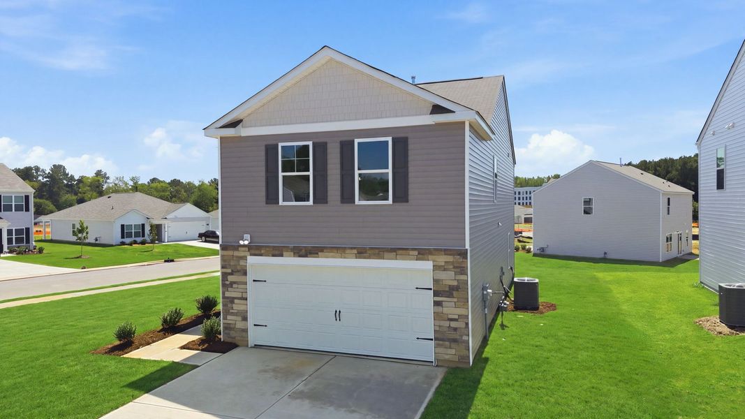 Front exterior of a new home in Hunter Hill, Rocky Mount, NC, highlighting curb appeal (Image 14). Front exterior of a new home in Hunter Hill, Rocky Mount, NC, highlighting curb appeal (Image 14).