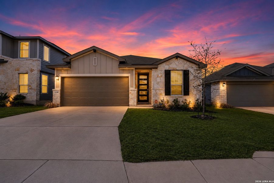 Front exterior of a new home in Remington Ranch, San Antonio, TX, highlighting curb appeal (Image 1). Front exterior of a new home in Remington Ranch, San Antonio, TX, highlighting curb appeal (Image 1).