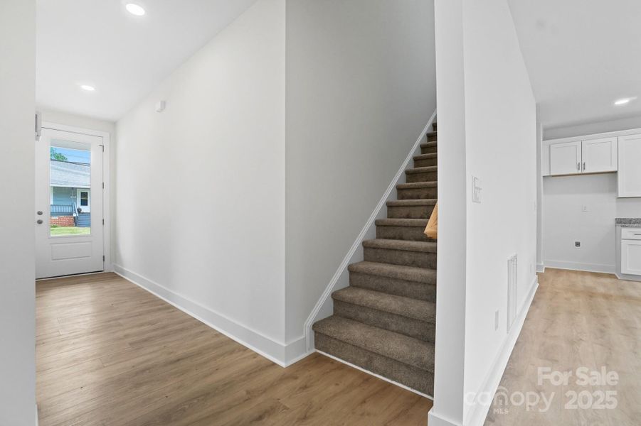 Foyer to the Stairwell upstairs Foyer to the Stairwell upstairs