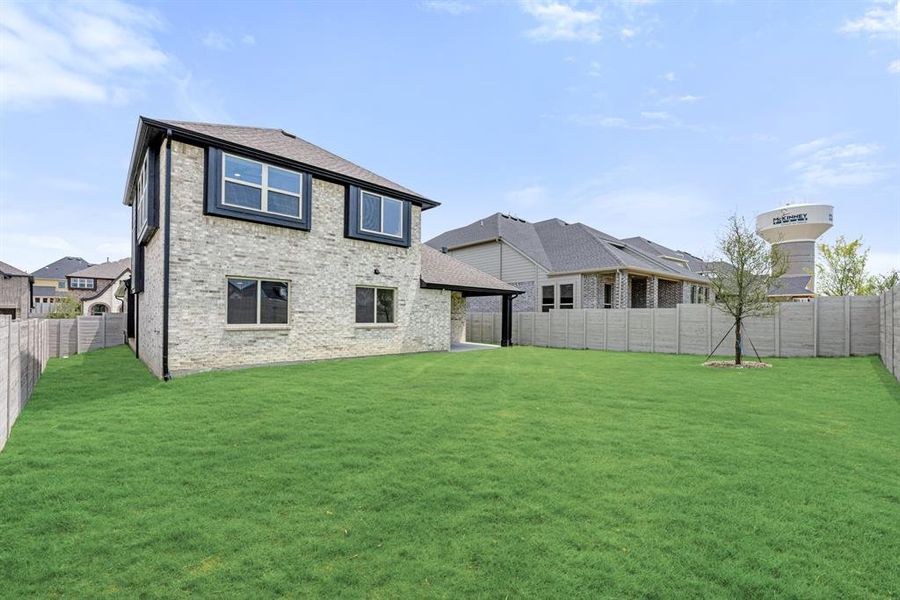 Front exterior of a new home in Painted Tree Woodland District 50, McKinney, TX, highlighting curb appeal (Image 24). Front exterior of a new home in Painted Tree Woodland District 50, McKinney, TX, highlighting curb appeal (Image 24).