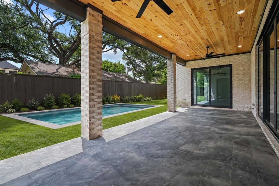 Plenty of space for a pool next to your covered patio! *Virtually staged*