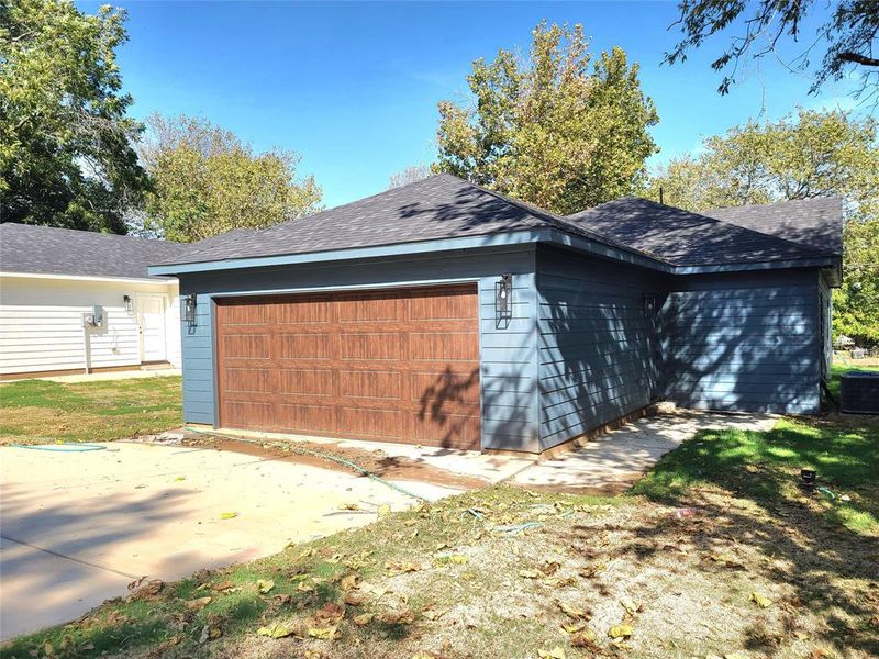 View of side of home with cooling unit