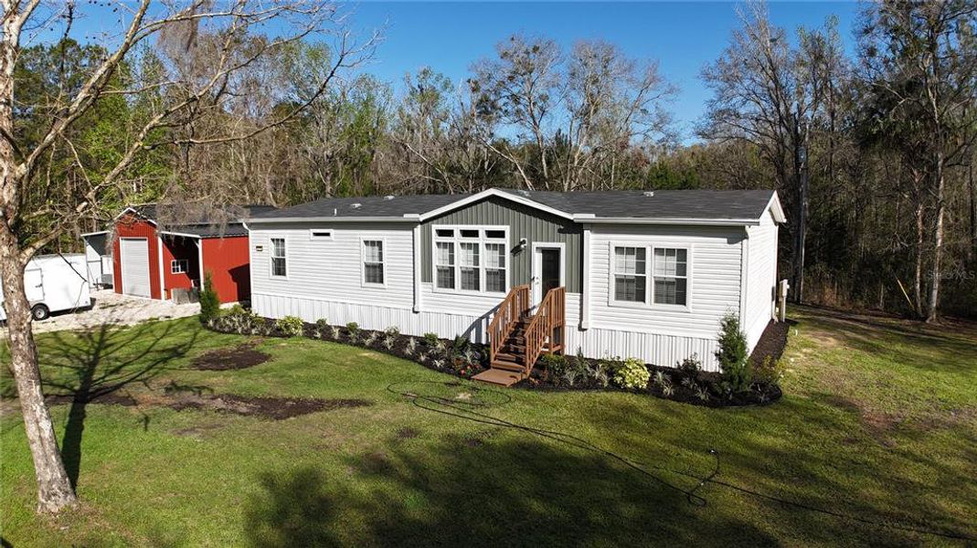 Front exterior of a new home in , Micanopy, FL, highlighting curb appeal (Image 12).