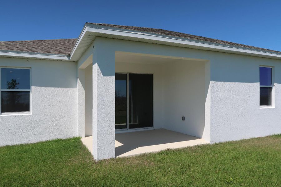 Front exterior of a new home in Ridgeview, Clermont, FL, highlighting curb appeal (Image 26).