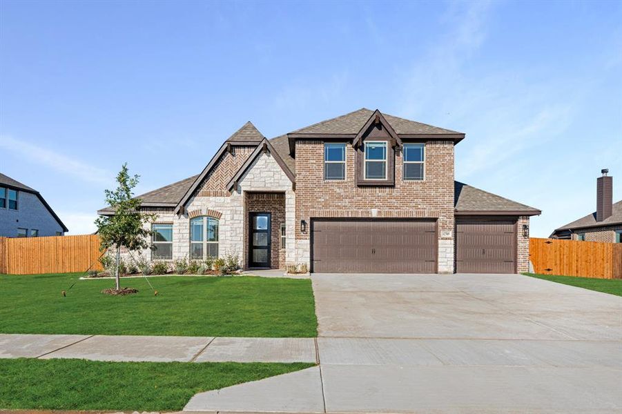 Front exterior of a new home in Coyote Crossing, Godley, TX, highlighting curb appeal (Image 2).
