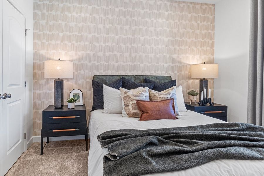 A bed with a blanket on it.