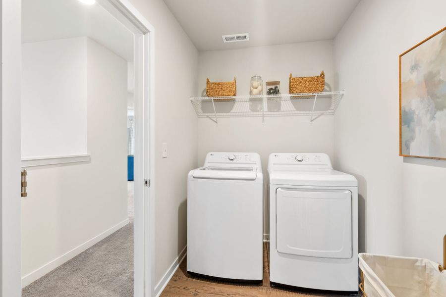 A laundry room with a washer and dryer. A laundry room with a washer and dryer.
