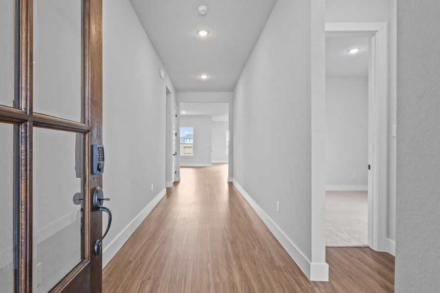 A hallway with white walls. A hallway with white walls.