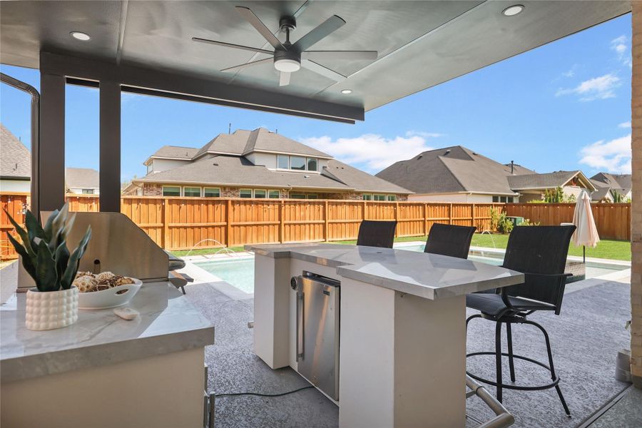 Exterior details and patio area of a home in Woodson’s Reserve, Spring (Image 26).