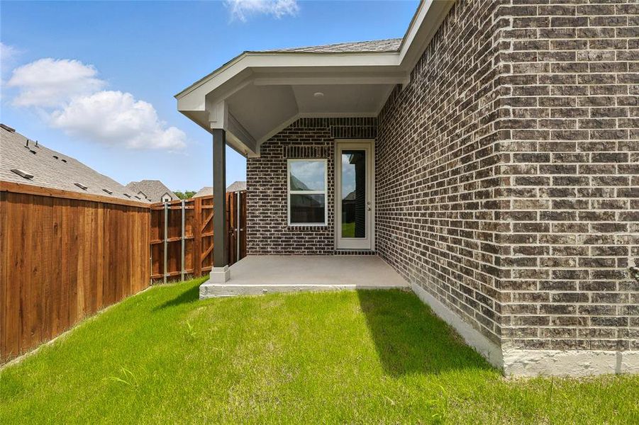 Exterior details and patio area of a home in Thompson Farms, Van Alstyne (Image 25). Exterior details and patio area of a home in Thompson Farms, Van Alstyne (Image 25).