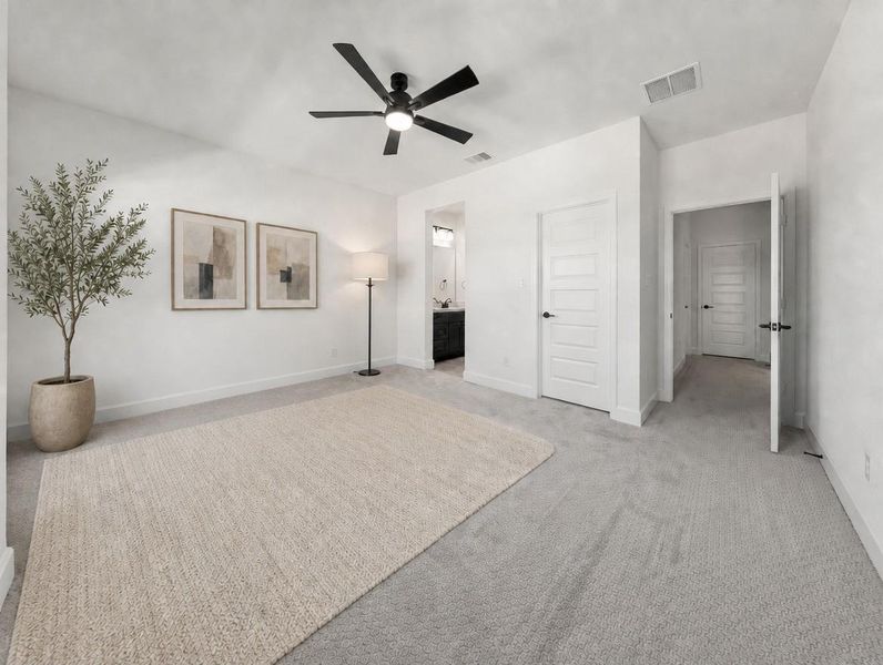 A well-lit bedroom featuring a textured rug and sleek overhead lighting, providing a serene retreat. A well-lit bedroom featuring a textured rug and sleek overhead lighting, providing a serene retreat.
