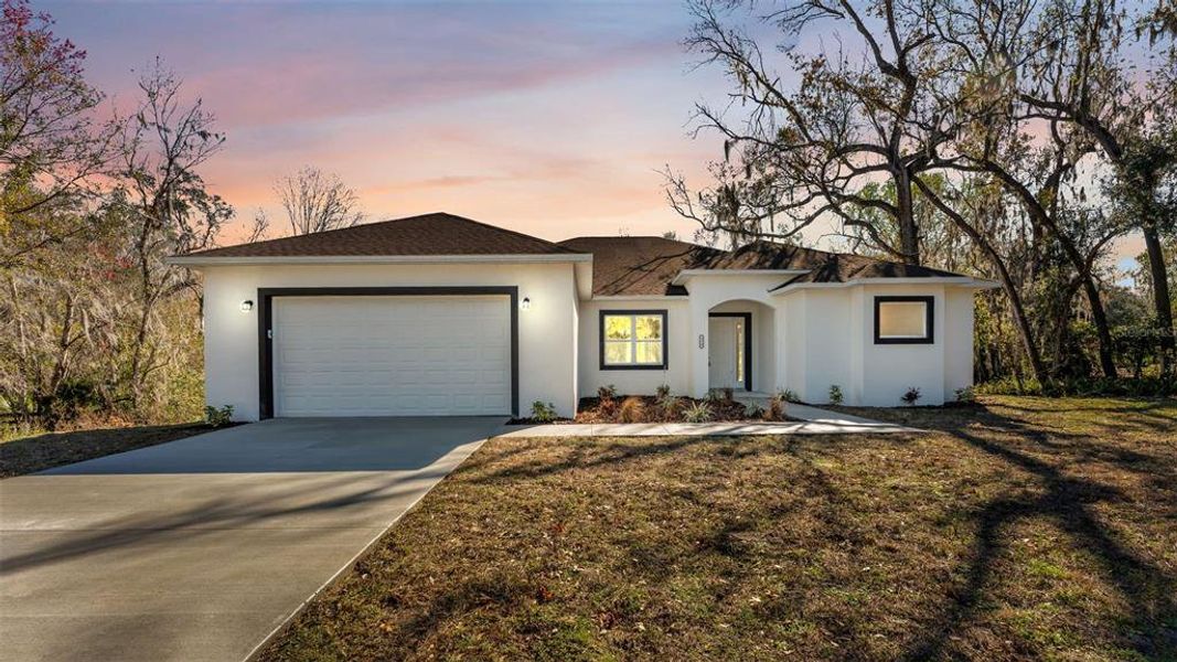 Front exterior of a new home in , Lakeland, FL, highlighting curb appeal (Image 2). Front exterior of a new home in , Lakeland, FL, highlighting curb appeal (Image 2).