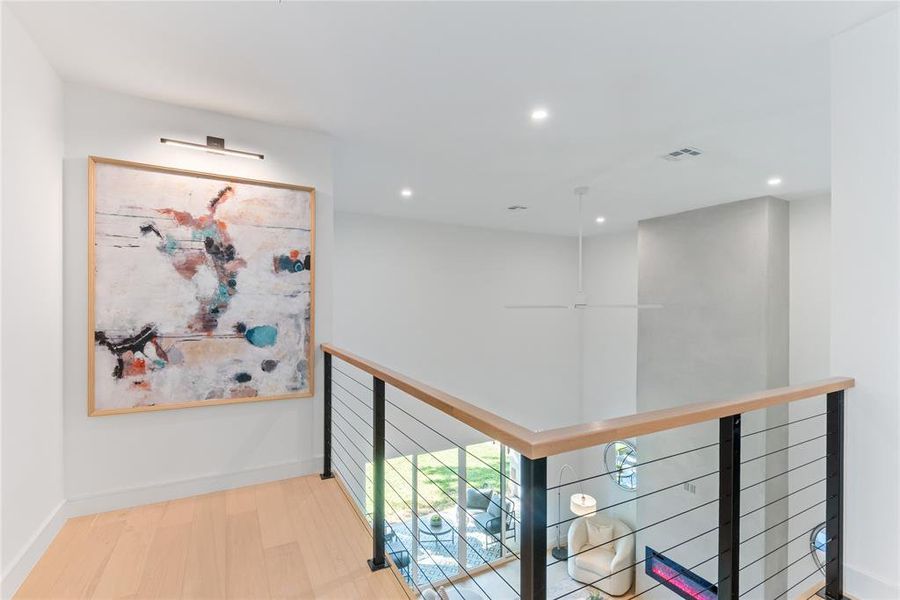 Upstairs, enjoy the art nook, easy communication with downstairs, and an oversized ceiling fan for the living area.