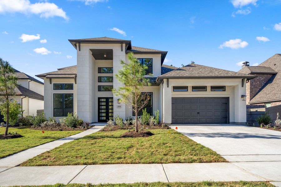 Front exterior of a new home in Artavia 70′ Lots, Conroe, TX, highlighting curb appeal (Image 25).