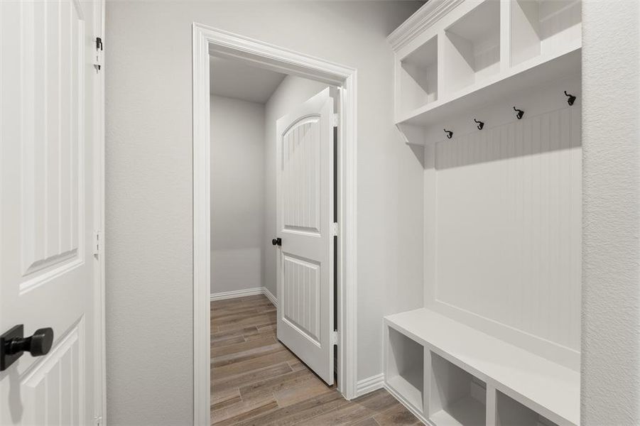 Mudroom with light wood finished floors and baseboards Mudroom with light wood finished floors and baseboards