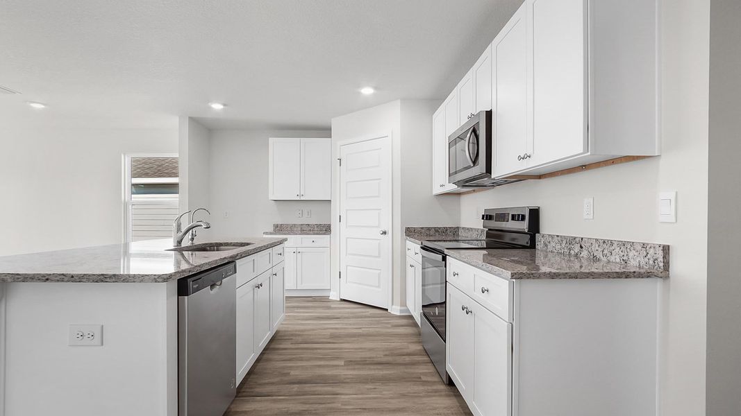 Furnished interior view inside a new home in Ashton Park Phase III, Freeport (Image 5).